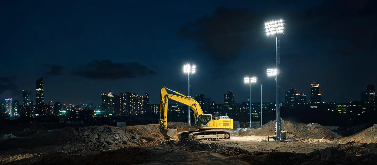 Night excavator worksite with LED lighting